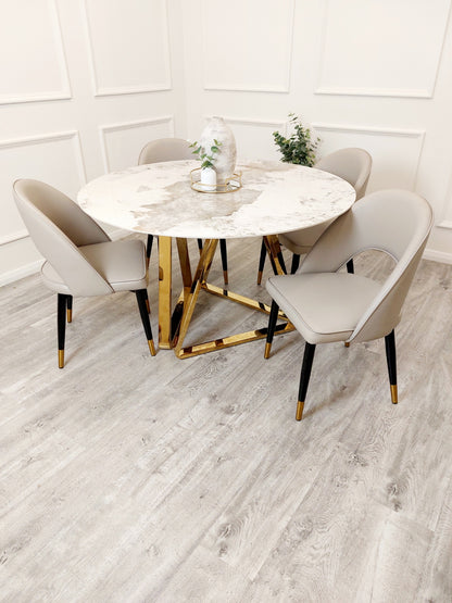 sinteed stone and gold base round dining table